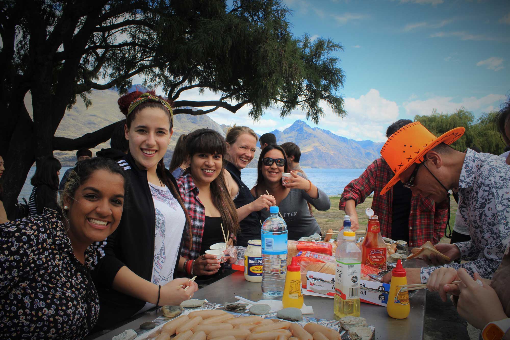 Students-having-bbq-by-the-lake